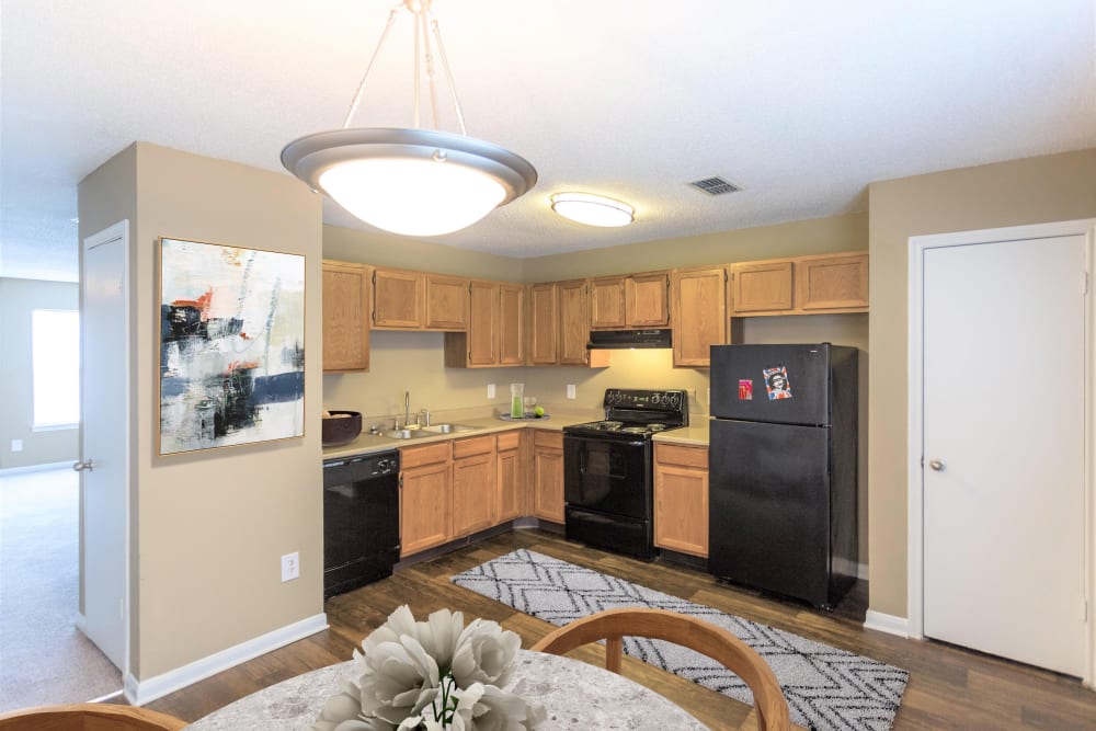 Kitchen with dark counter tops at Cypress Creek Townhomes in Goodlettsville, Tennessee