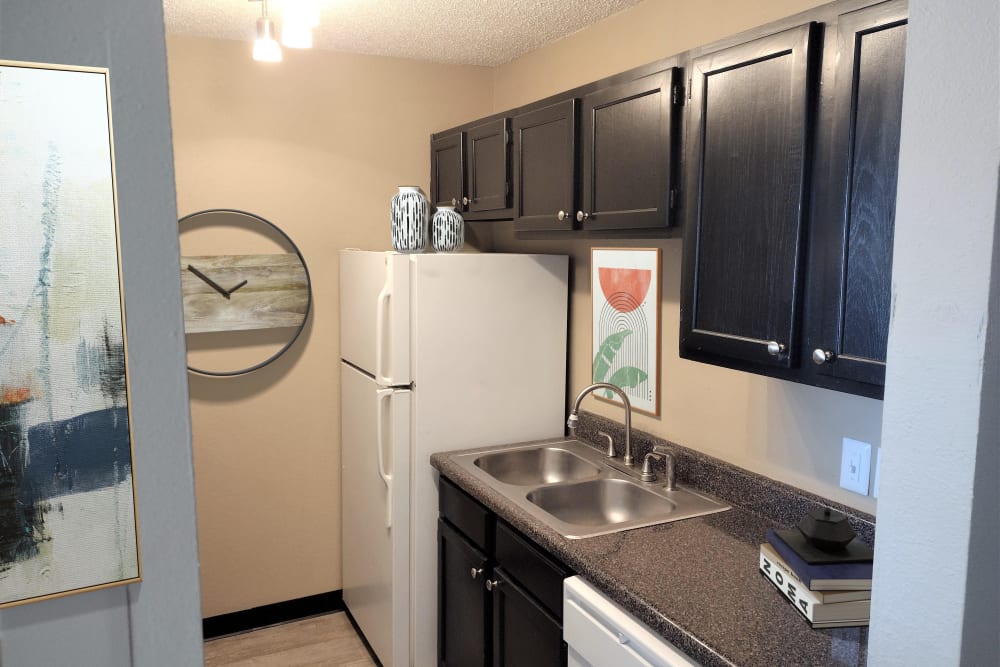 Kitchen with black appliances at Cypress Creek Townhomes in Goodlettsville, Tennessee