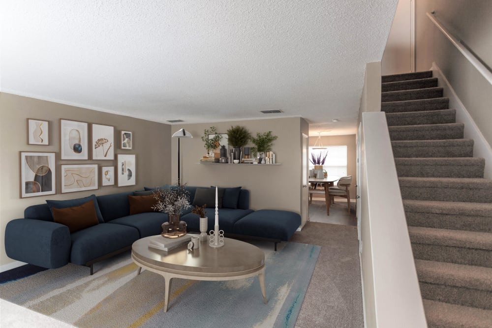 Living room with plush carpeting at Cypress Creek Townhomes in Goodlettsville, Tennessee