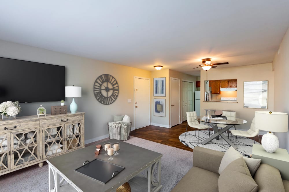 Living room with carpeting and ceiling fan at Southwood Apartments in Nashville, Tennessee