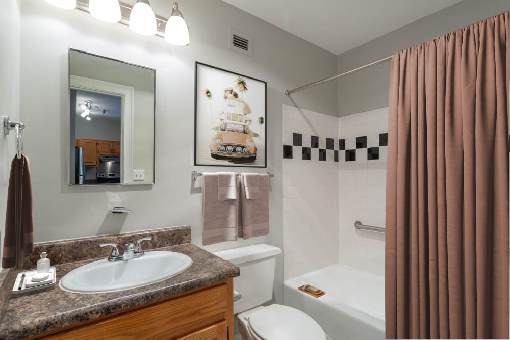 Bathroom with great lighting at The Grand Apartments in Chattanooga, Tennessee