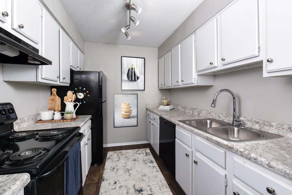 Kitchen with modern appliances at Valley Station Apartment Homes in Birmingham, Alabama