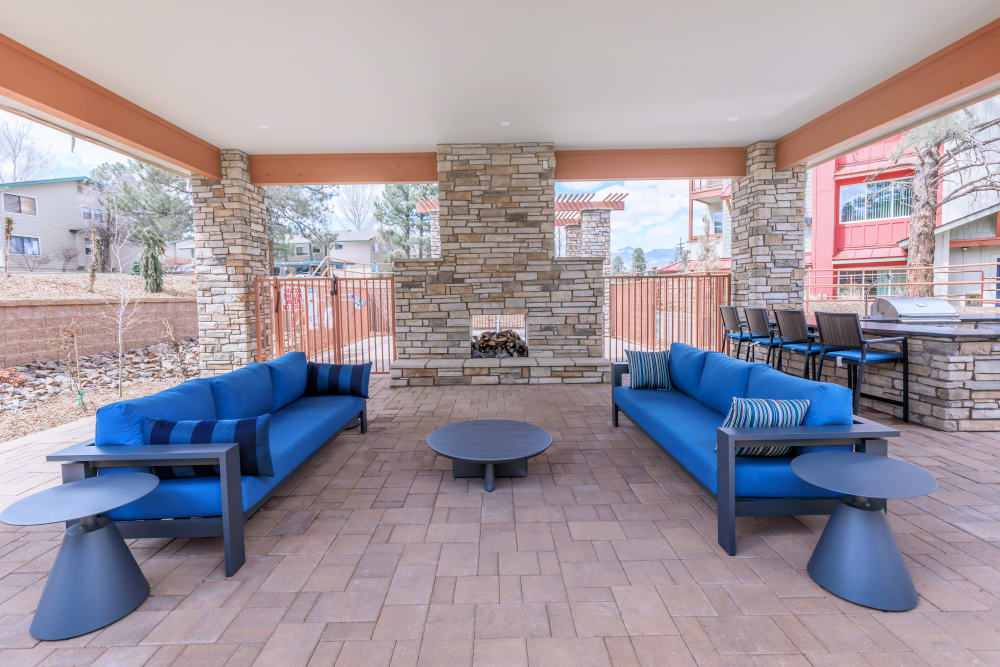 Patio seating and fireplace at Trailside Apartments in Flagstaff, Arizona