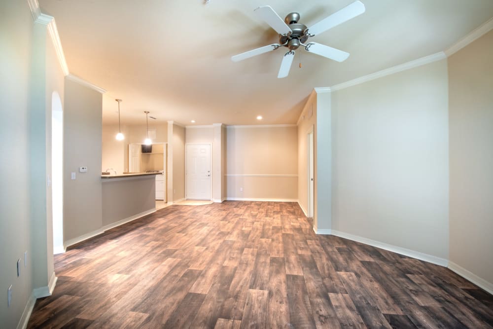 Beautiful hardwood flooring throughout the living areas of a model home at Mirador & Stovall at River City in Jacksonville, Florida