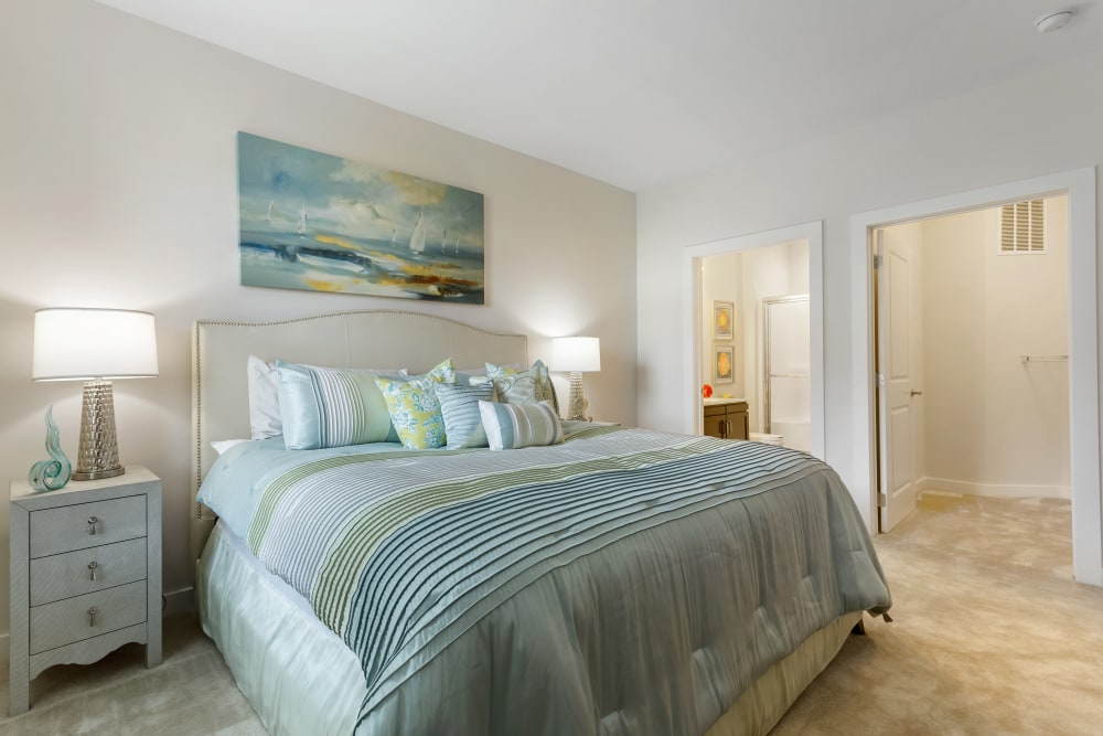 A well-made king sized bed in a main bedroom at Sound at Gateway Commons in East Lyme, Connecticut