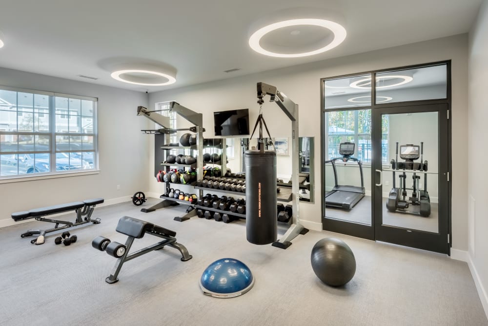 Modern exercise equipment in the fitness center at Cove at Gateway Commons in East Lyme, Connecticut