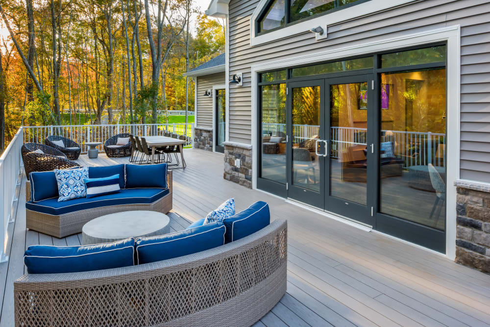 Outdoor seating on the clubhouse patio at Cove at Gateway Commons in East Lyme, Connecticut