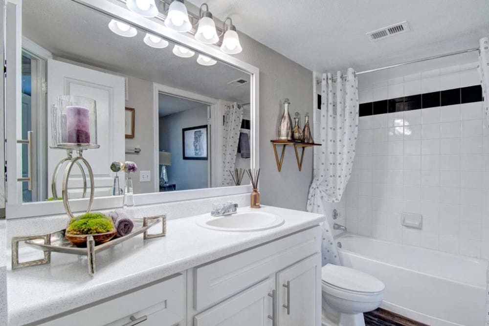 Bathroom with mirror at Arbrook Park Apartment Homes in Arlington, Texas