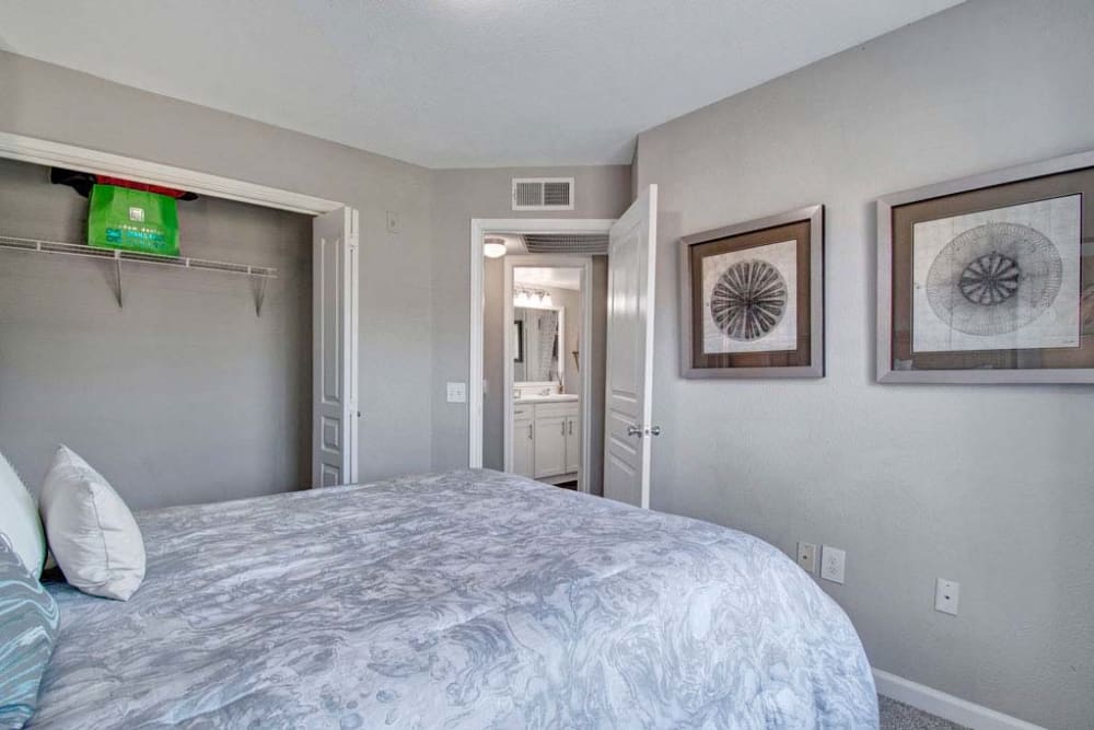 Bedroom with paintings at Arbrook Park Apartment Homes in Arlington, Texas