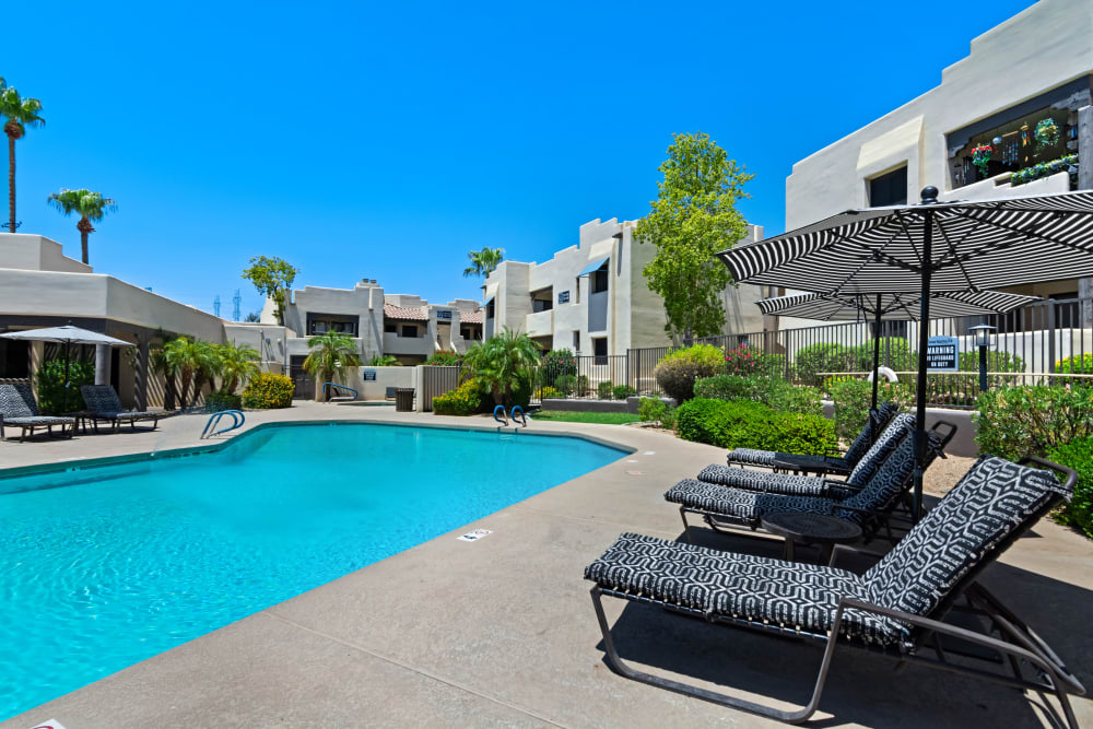 Comfortable lounge chairs by at Casa Santa Fe Apartments in Scottsdale, Arizona
