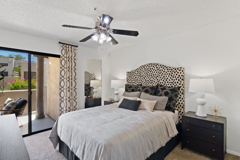 Spacious bedroom with ceiling fan at Casa Santa Fe Apartments in Scottsdale, Arizona