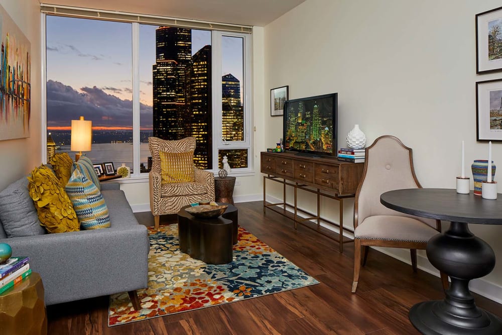 Living room with view of sunset at Murano in Seattle, Washington