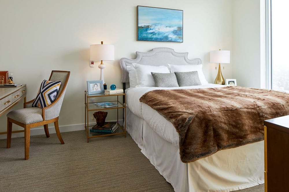 Bedroom with brown blanket at Murano in Seattle, Washington
