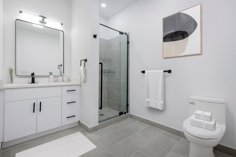 Renovated bathroom with walk-in shower In Select Apartments | 55 Riverwalk Place in West New York