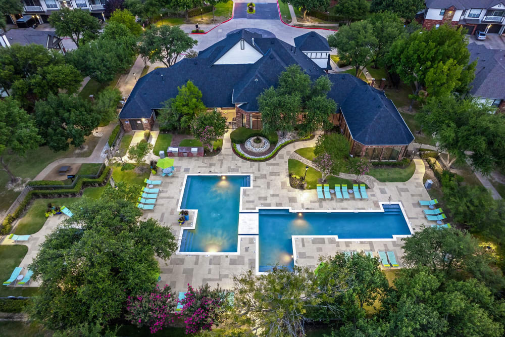 Resort style pool drone shot and leasing office at at Marquis at Stonebriar in Frisco, Texas