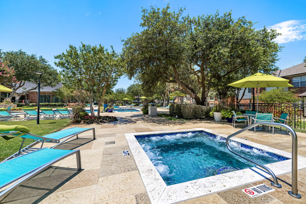 Resort-style Swimming pool with hot tub at Marquis at Stonebriar in Frisco, Texas
