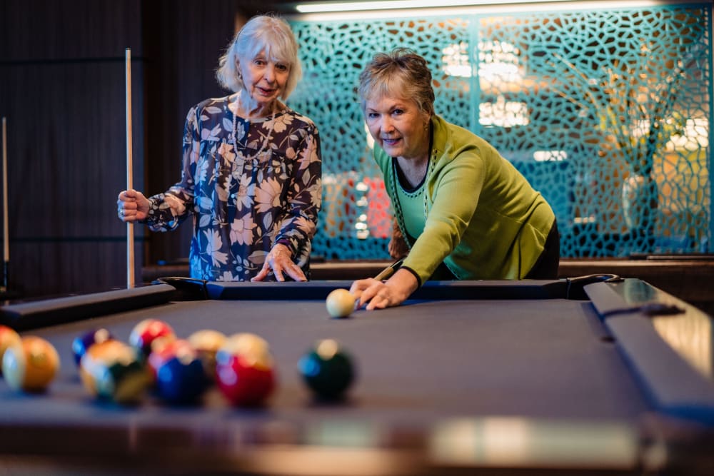 Residents playing pool at Murano in Seattle, Washington