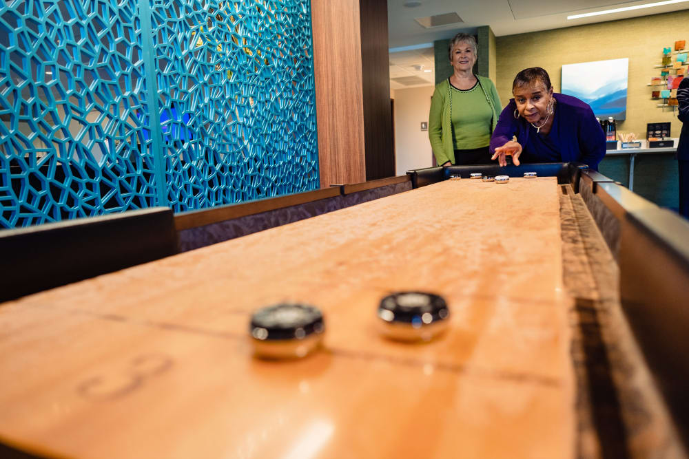 Residents playing shuffleboard at Murano in Seattle, Washington