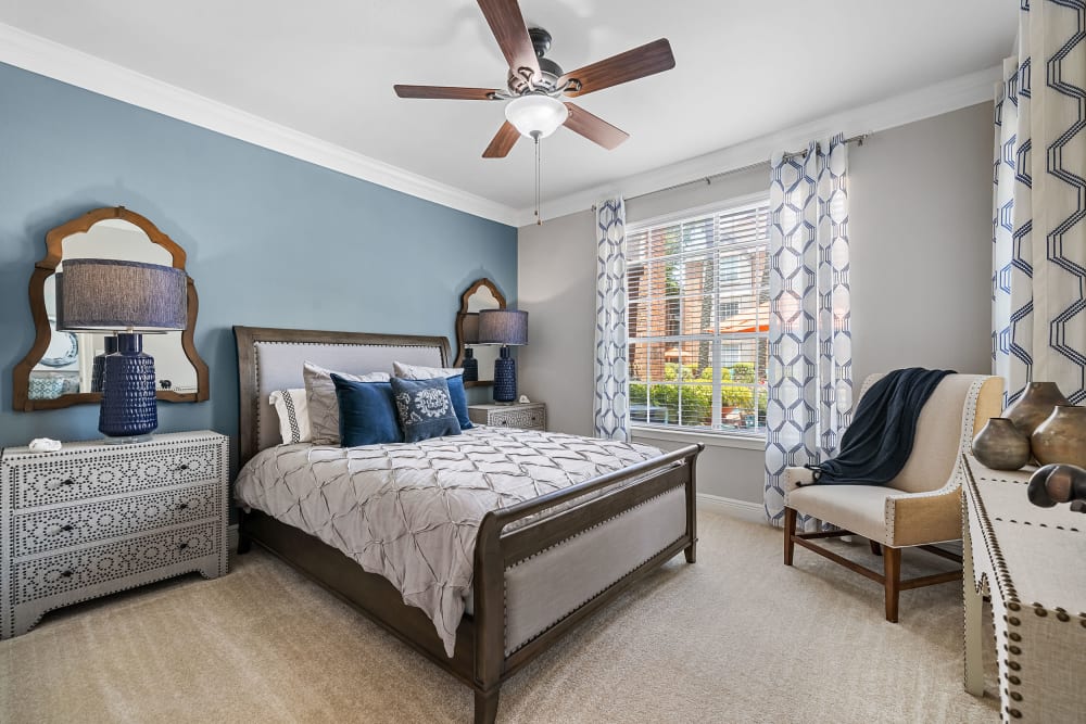 Spacious bedroom with carpet floors at Marquis on Pin Oak in Houston, Texas
