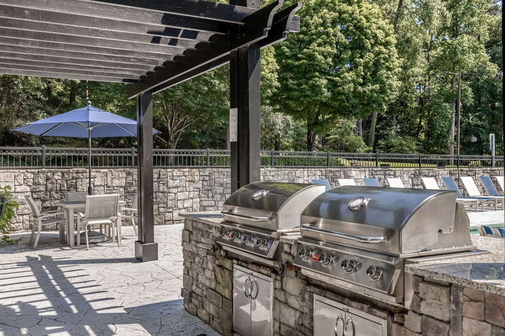 Gas grills near the pool at Marq Perimeter in Atlanta, Georgia