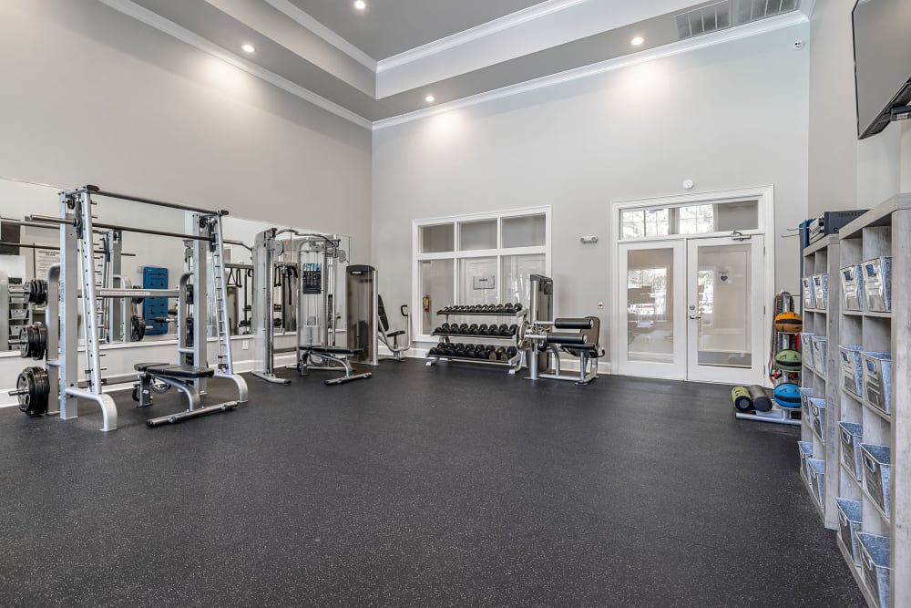 Fitness center with weight lifting equipment at Marq Perimeter in Atlanta, Georgia