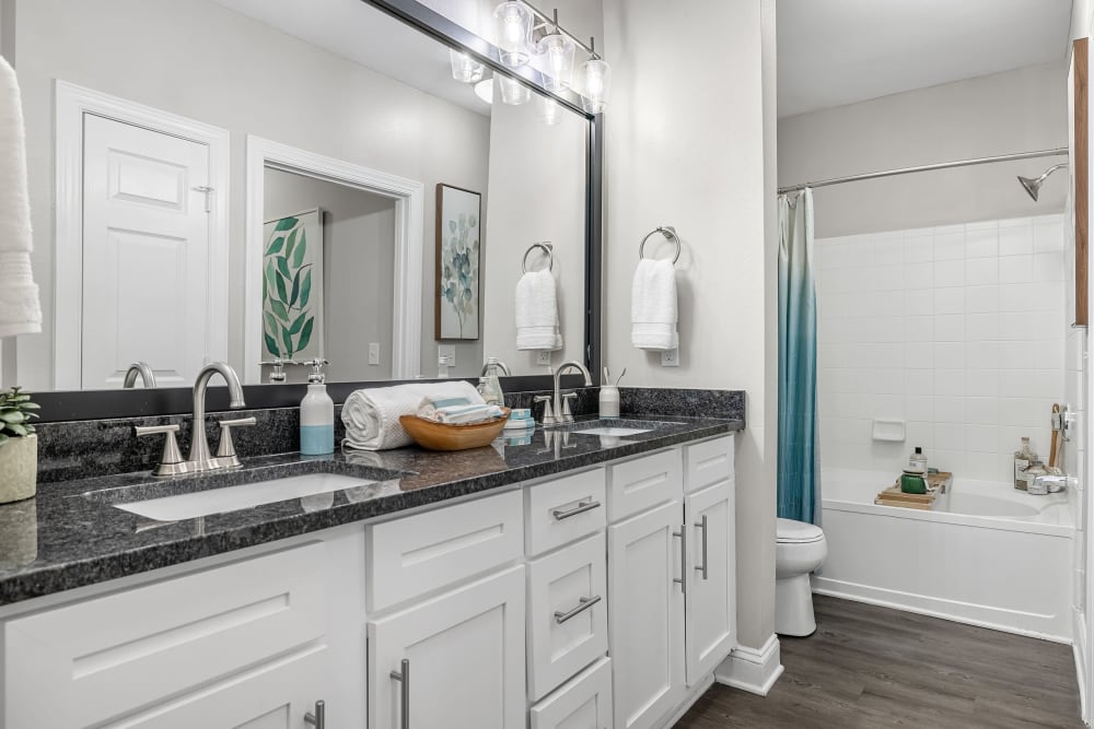 Double vanity sink and spacious bathroom at Marq Perimeter in Atlanta, Georgia