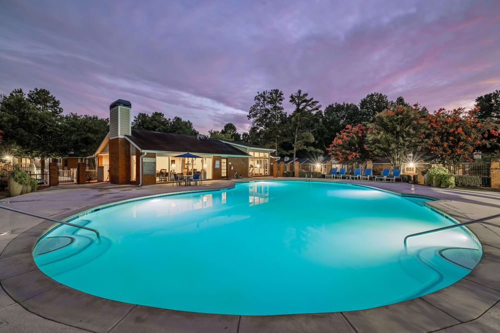 Swimming pool surrounded by trees at Marquis at Perimeter Center in Atlanta, Georgia