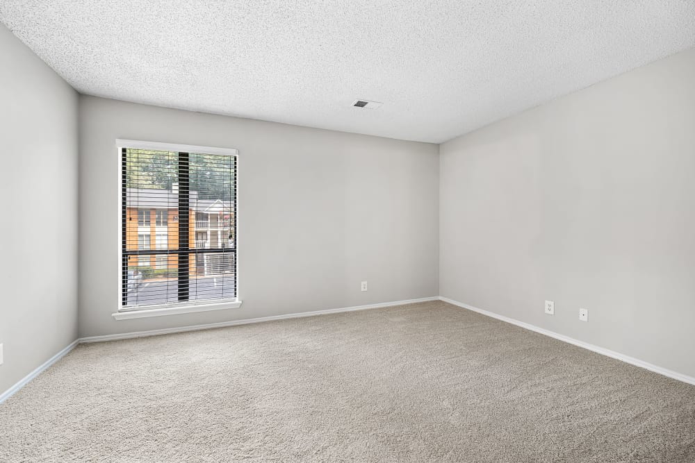 Bedroom with carpeted floors at Marquis at Perimeter Center in Atlanta, Georgia