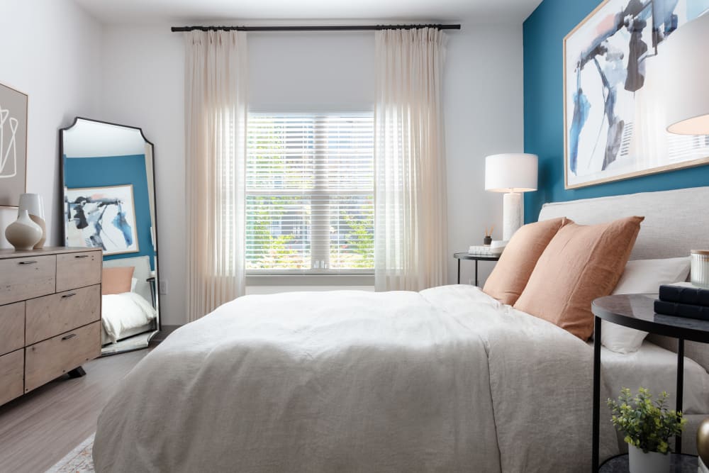 Well-lit bedroom at Alleia Luxury Apartments in Savannah, Georgia