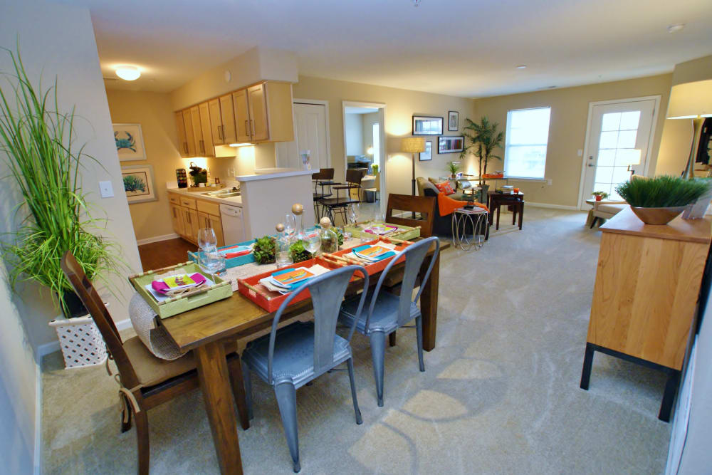 Dining room, kitchen, and living room of a model apartment at Arbor Brook in Murfreesboro, Tennessee