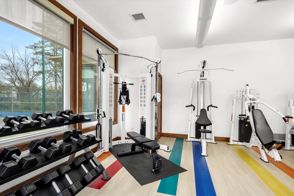 Strength training equipment in the fitness center at Fairmont Park Apartments in Farmington Hills, Michigan
