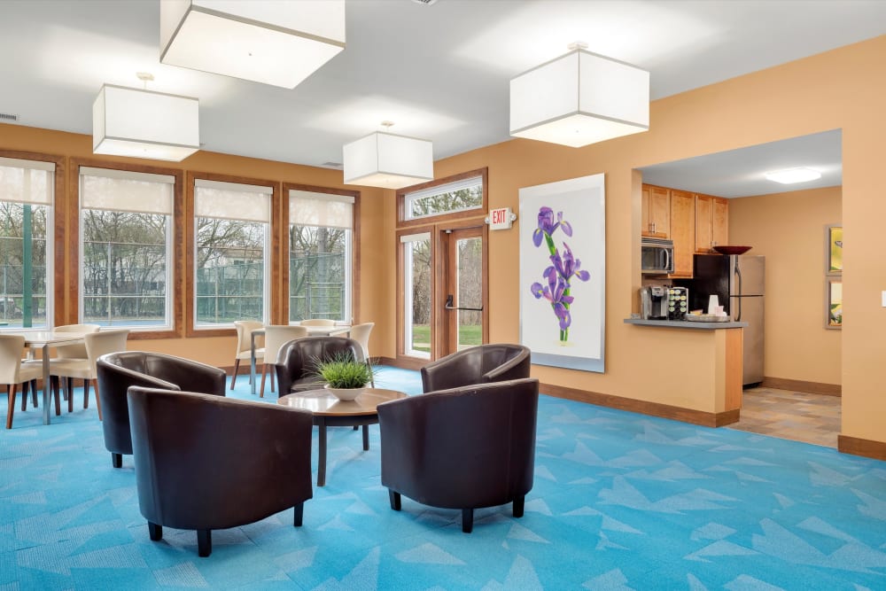 Clubhouse lounge and kitchen at Fairmont Park Apartments in Farmington Hills, Michigan