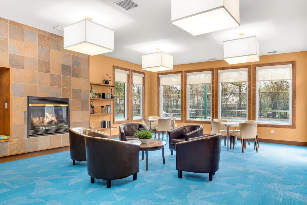 Common room with a gas fireplace at Fairmont Park Apartments in Farmington Hills, Michigan