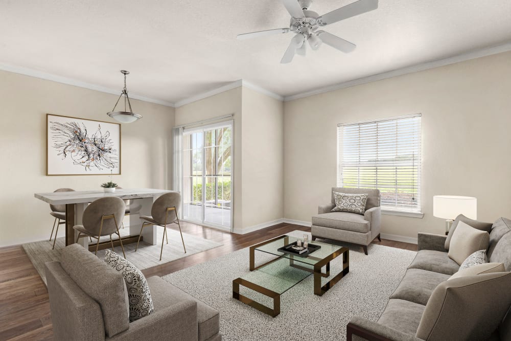 Model livingroom with soft carpet at Harbortown Apartments in Orlando, Florida