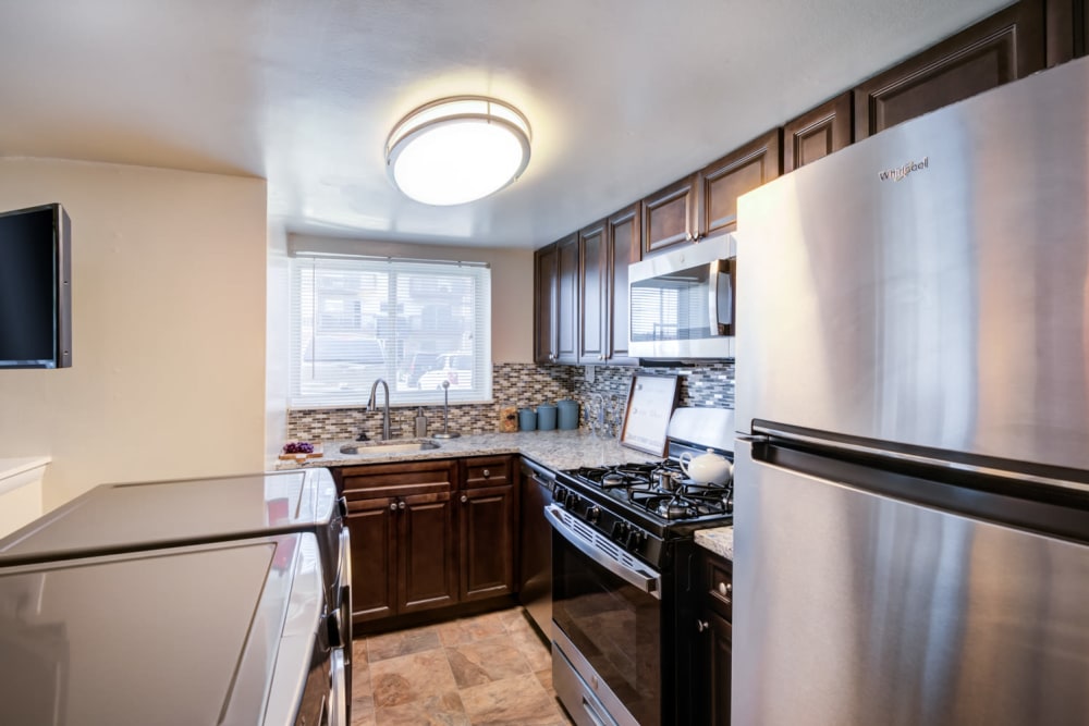 Kitchen with Modern Appliances at Princeton Estates Apartment Homes in Temple Hills, Maryland