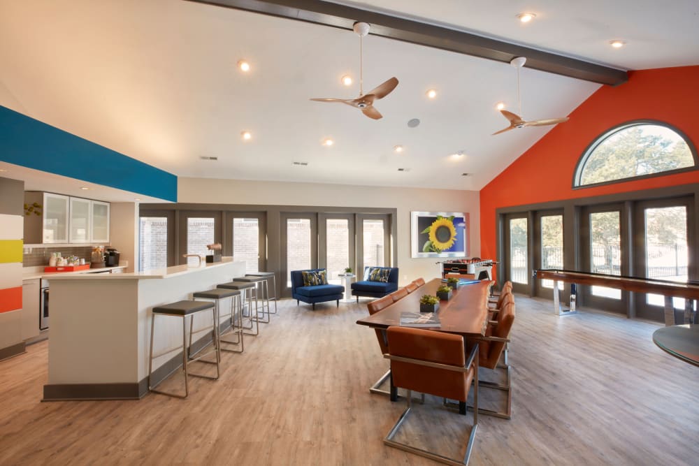 Clubhouse with kitchen, games, and plenty of seating options for work or play at Lakeside Terraces in Sterling Heights, Michigan