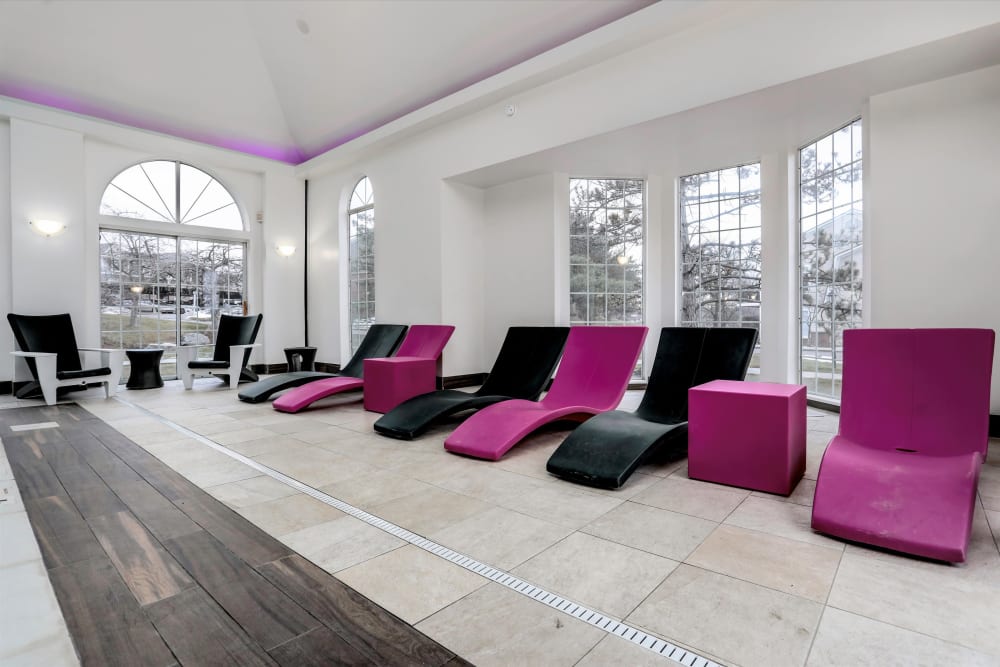 Lounge chairs by the indoor pool at Citation Club in Farmington Hills, Michigan