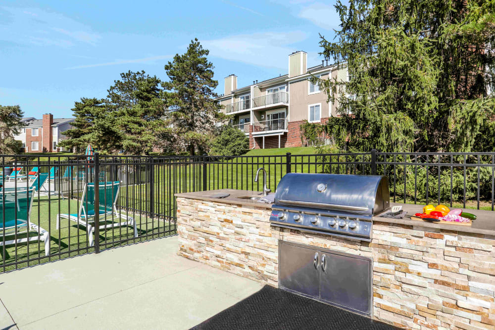 Outdoor kitchen with gas grilling station at Citation Club in Farmington Hills, Michigan