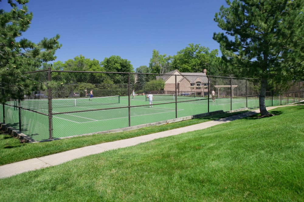 Two lighted tennis courts at Saddle Creek Apartments in Novi, Michigan