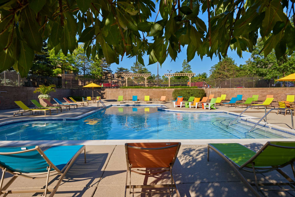 Beautifully designed outdoor swimming pool at Saddle Creek Apartments in Novi, Michigan