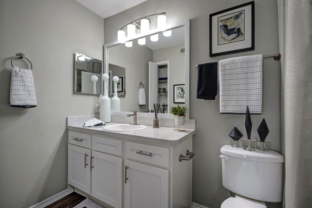 Bathroom with vanity mirror at Apartments in Sugar Land, Texas