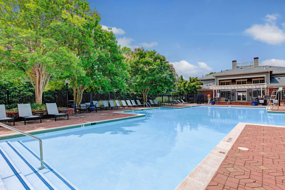 Pool view with trees at Woodway at Trinity Centre in Centreville, Virginia