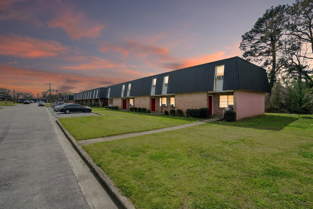 An apartment building at twilight at Garrett Woods Apartment Homes in Phenix City, Alabama