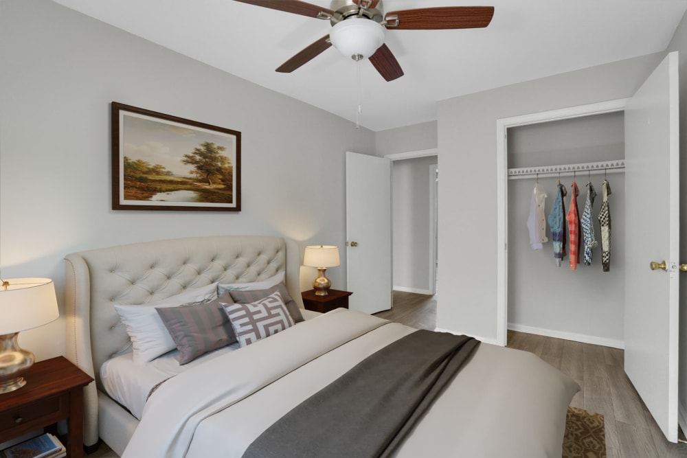 An apartment bedroom with a ceiling fan at Garrett Woods Apartment Homes in Phenix City, Alabama