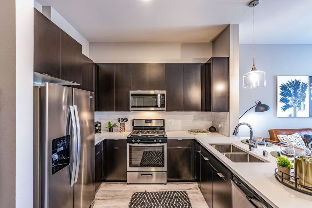 Energy efficient stainless-steel appliances in a model home's kitchen at Jade Apartments in Las Vegas, Nevada