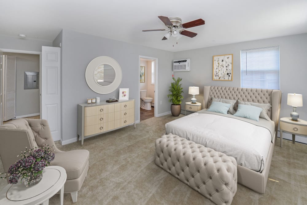 Spacious main bedroom with bathroom at Woodacres Apartment Homes in Claymont, DE