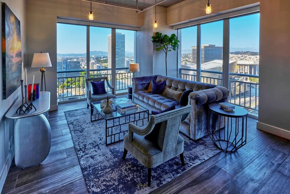 Apartment living room with a balcony at Museum Tower in Los Angeles, California