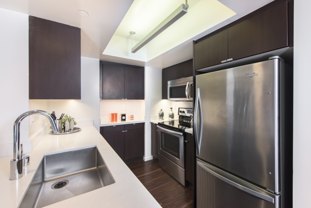 apartment kitchen with stainless steel finishes at 255 Grand in Los Angeles, California