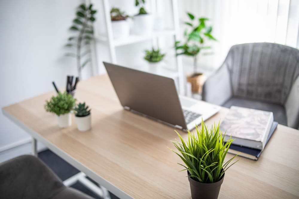 A laptop on a desk in a home office at Village at Glenhaven in Greenwood, South Carolina