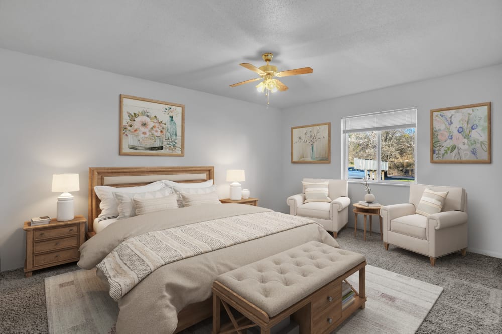 A large bedroom with a king sized bed and ceiling fan at Palmetto Circle in North Augusta, South Carolina